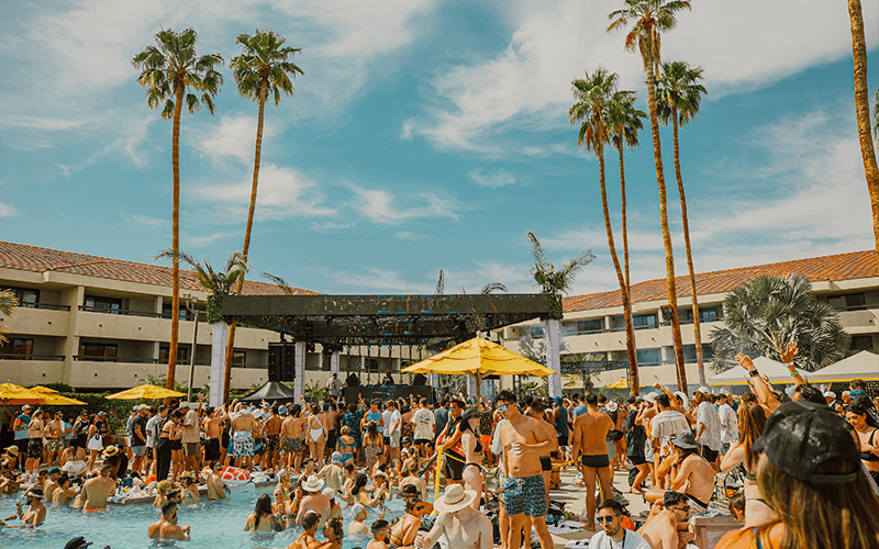 Festival crowd gathered around the Hilton Palm Springs pool during Splash House.